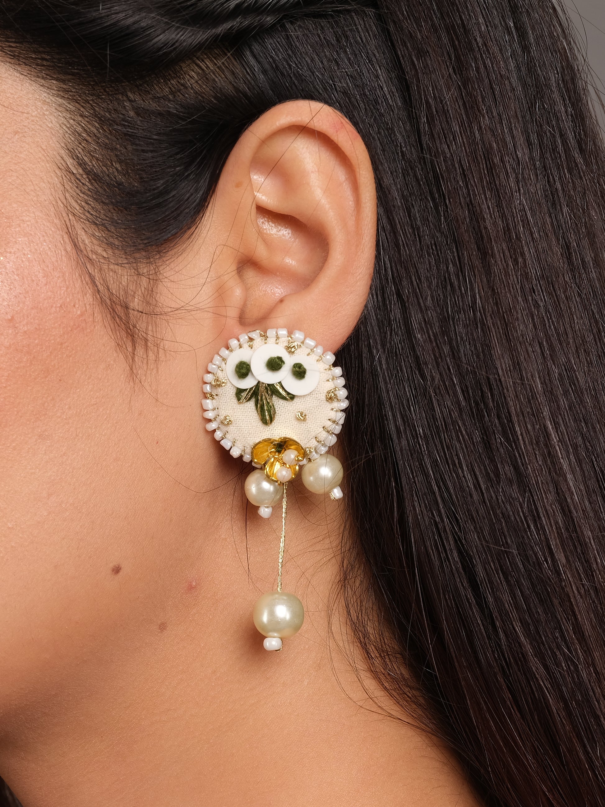 Close-up of ivory floral beaded pearl drop earrings showing detailed craftsmanship - bohemian handmade earrings